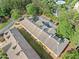 Aerial view of apartment complex with well-kept roofs, landscaping, and visible community amenities at 717 Beaufort Cir, Duluth, GA 30096