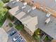 Aerial view showcases this apartment building's layout, surrounding landscaping, and parking at 717 Beaufort Cir, Duluth, GA 30096