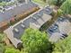 An aerial view of a well-maintained apartment complex with lush landscaping and ample parking space at 717 Beaufort Cir, Duluth, GA 30096