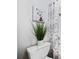 Cozy bathroom features a toilet, a plant decoration and a patterned shower curtain at 717 Beaufort Cir, Duluth, GA 30096