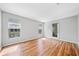 Spacious bedroom with hardwood flooring, windows and a door for natural light at 717 Beaufort Cir, Duluth, GA 30096