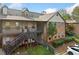 Exterior view of a well-maintained apartment building with ample parking and stairs leading up to the units at 717 Beaufort Cir, Duluth, GA 30096