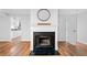 Living room fireplace, hardwood flooring, and neutral color at 717 Beaufort Cir, Duluth, GA 30096