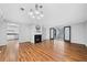 Spacious living room featuring hardwood floors, fireplace, and sliding glass doors at 717 Beaufort Cir, Duluth, GA 30096