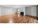 Living room with fireplace, hardwood flooring, and neutral paint at 717 Beaufort Cir, Duluth, GA 30096