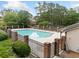 Community pool with brick pillars surrounded by lush greenery offers a refreshing and inviting escape at 717 Beaufort Cir, Duluth, GA 30096