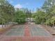 Outdoor tennis courts surrounded by trees, providing a recreational space for residents at 717 Beaufort Cir, Duluth, GA 30096