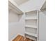 Walk-in closet with shelves and hanging bars at 717 Beaufort Cir, Duluth, GA 30096