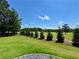 Lush green backyard with a golf course view at 8967 Midlothian Ct, Winston, GA 30187