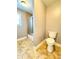 Bathroom featuring a toilet and a shower with glass doors at 8967 Midlothian Ct, Winston, GA 30187
