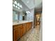 Bathroom featuring double sink vanity with tile flooring at 8967 Midlothian Ct, Winston, GA 30187