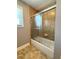 Bathroom shower featuring tiled walls and sliding glass doors at 8967 Midlothian Ct, Winston, GA 30187