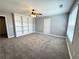 Spacious bedroom featuring a ceiling fan and built-in shelving at 8967 Midlothian Ct, Winston, GA 30187