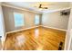 Bright, spacious bedroom with hardwood floors and a ceiling fan, providing a comfortable space at 8967 Midlothian Ct, Winston, GA 30187