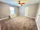 Carpeted bedroom features a window bench for added charm at 8967 Midlothian Ct, Winston, GA 30187