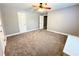 Bright carpeted bedroom with a ceiling fan and ample space at 8967 Midlothian Ct, Winston, GA 30187