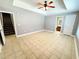 Spacious bedroom featuring tile floors and a ceiling fan at 8967 Midlothian Ct, Winston, GA 30187