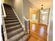 Entry foyer with stairway and front door with decorative oval window at 8967 Midlothian Ct, Winston, GA 30187