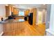 Well-lit kitchen with wood cabinets, granite counters, and stainless steel appliances at 8967 Midlothian Ct, Winston, GA 30187