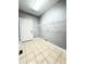Laundry room with tile floor, storage shelves and gray painted walls at 8967 Midlothian Ct, Winston, GA 30187