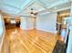 Spacious living room featuring hardwood floors, a coffered ceiling, and fireplace at 8967 Midlothian Ct, Winston, GA 30187