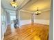 Spacious living room with hardwood floors, decorative molding, and elegant chandelier lighting at 8967 Midlothian Ct, Winston, GA 30187