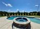Inviting in-ground pool with a built-in hot tub at 8967 Midlothian Ct, Winston, GA 30187