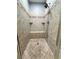 Tiled shower with bench, built in shelves and showerhead at 8967 Midlothian Ct, Winston, GA 30187