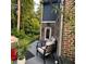 Inviting back patio with comfortable seating, lush plants, and a grill, perfect for enjoying the outdoors at 201 Jonquil Spring Rd, Woodstock, GA 30188