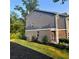 Backyard view of a blue and brick home, with mulch and grass landscaping at 201 Jonquil Spring Rd, Woodstock, GA 30188