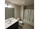 Bathroom with white countertop vanity and shower/tub with white shower curtain at 201 Jonquil Spring Rd, Woodstock, GA 30188