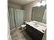 Practical bathroom with a single sink vanity, toilet, and shower-tub combination at 201 Jonquil Spring Rd, Woodstock, GA 30188