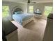 Spacious bedroom features plush carpeting, ceiling fan, and lots of natural light at 201 Jonquil Spring Rd, Woodstock, GA 30188