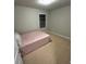 Cozy bedroom with a comfortable bed and soft carpet flooring at 201 Jonquil Spring Rd, Woodstock, GA 30188