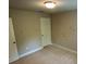 Bedroom with neutral carpet and two doors, ready for personalization at 201 Jonquil Spring Rd, Woodstock, GA 30188