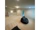 Large, carpeted bonus room with recessed lighting and a beanbag chair at 201 Jonquil Spring Rd, Woodstock, GA 30188