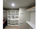 Walk-in closet with custom shelving and ample storage space at 201 Jonquil Spring Rd, Woodstock, GA 30188