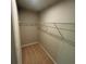 Walk-in closet with carpet and wire shelving for optimal storage at 201 Jonquil Spring Rd, Woodstock, GA 30188