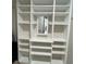 Bright closet offering ample storage with built-in shelving and mirror at 201 Jonquil Spring Rd, Woodstock, GA 30188