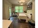 Cozy dining area with a bench and table, enhanced by natural light from the window at 201 Jonquil Spring Rd, Woodstock, GA 30188