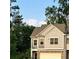 Townhome with neutral color scheme and a view of mature trees at 201 Jonquil Spring Rd, Woodstock, GA 30188