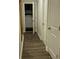 Hallway view leading into a laundry area with a washer and dryer at 201 Jonquil Spring Rd, Woodstock, GA 30188