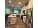 Modern kitchen with stainless steel appliances and an island perfect for meal preparation and casual dining at 201 Jonquil Spring Rd, Woodstock, GA 30188