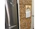 Refrigerator door with wine cork board art at 201 Jonquil Spring Rd, Woodstock, GA 30188