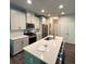 Well-appointed kitchen with modern appliances, ample counter space, and white cabinets at 201 Jonquil Spring Rd, Woodstock, GA 30188