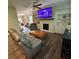 Bright living room features a fireplace with built-in shelving, and comfortable seating arrangement at 201 Jonquil Spring Rd, Woodstock, GA 30188