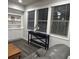 Living room featuring hardwood floors, built-in cabinets, and natural light at 201 Jonquil Spring Rd, Woodstock, GA 30188