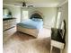 Main bedroom featuring large windows, ceiling fan, and elegant furniture at 201 Jonquil Spring Rd, Woodstock, GA 30188