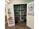 Spacious pantry with ample shelving for food storage and organization in this well-designed home at 201 Jonquil Spring Rd, Woodstock, GA 30188