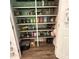 Walk-in pantry features sturdy shelving for optimal storage and organization at 201 Jonquil Spring Rd, Woodstock, GA 30188